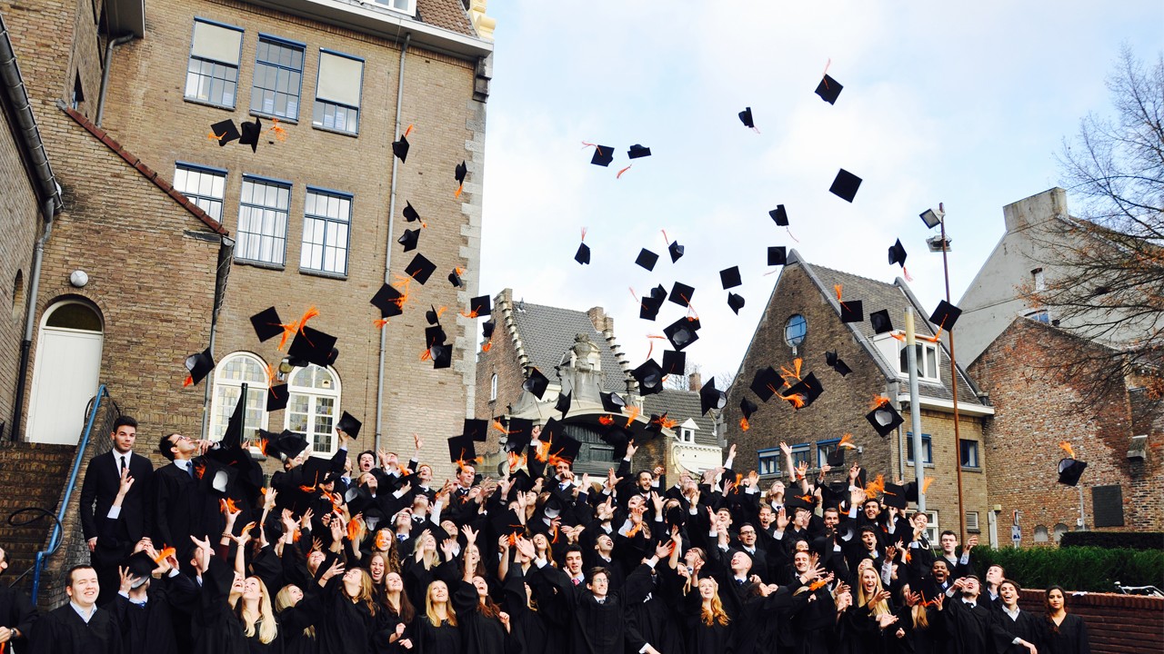 college students are throwing their graduation caps happily; image used for HSBC Sri Lanka International Overseas Education Page