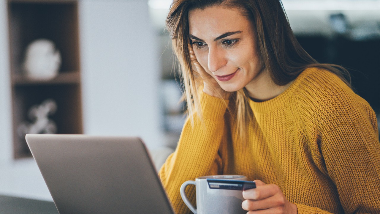 a woman is looking at her laptop; image used for HSBC Sri Lanka Card Instalment Plan page