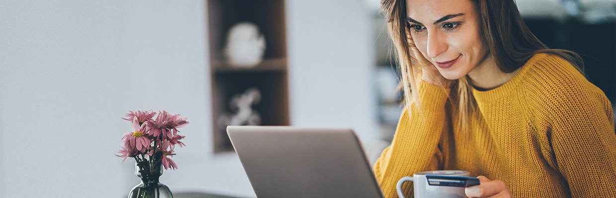 a woman is looking at her laptop; image used for HSBC Sri Lanka Card Instalment Plan page