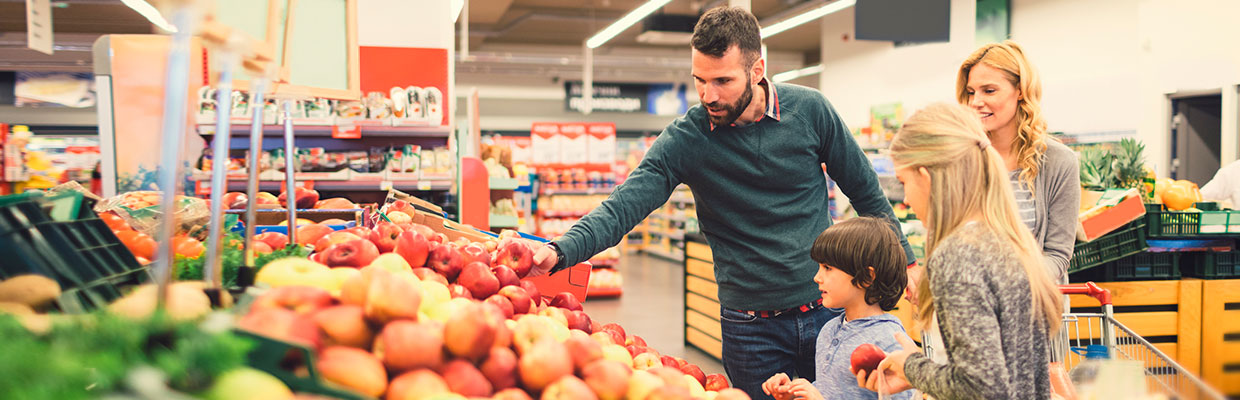 Family shopping at the grocery store; image used for HSBC Sri Lanka Daily Essentials page