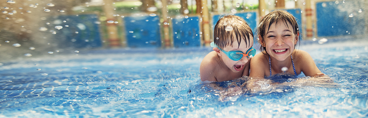 a little girl and a boy playing at water park; image used for HSBC Sri Lanka credit card local holiday offer page.