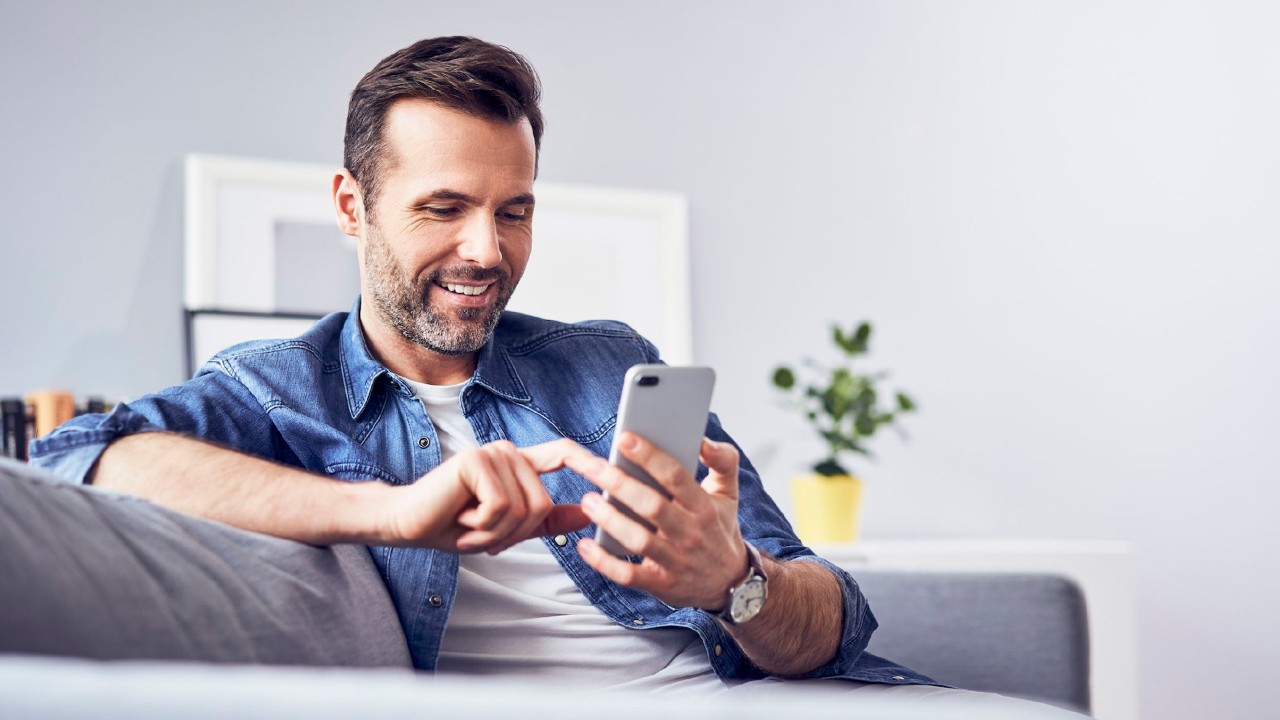 A man is using mobile phone