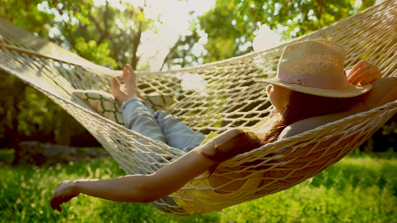 woman with hat resting