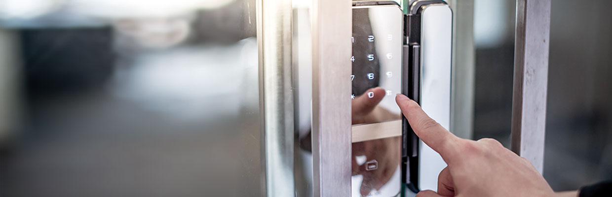 fingers going to touch an electronic locks on a door; image used for HSBC LK secure password page