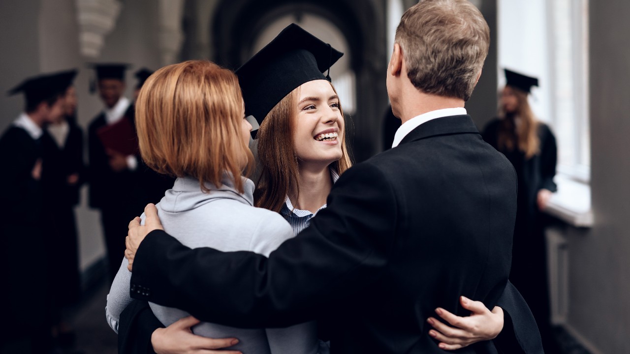 Parents and daughter at graduation