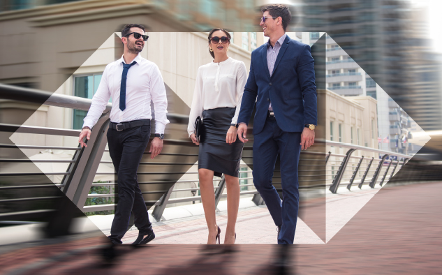 three business executives are walking together and having an pleasant discussion; image used for HSBC Sri Lanka Loans Referral Page