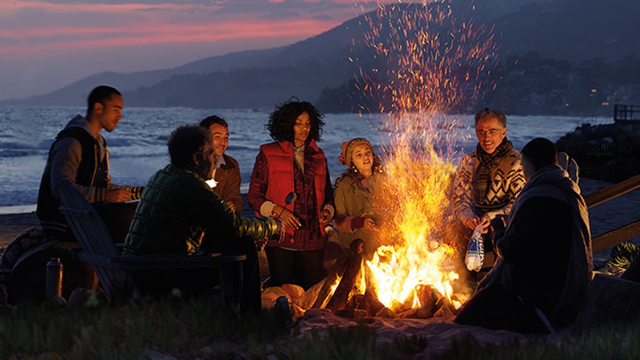 a group of friends are talking in circle with camp fire;image used for HSBC Premier Accounts and Services Landing Page