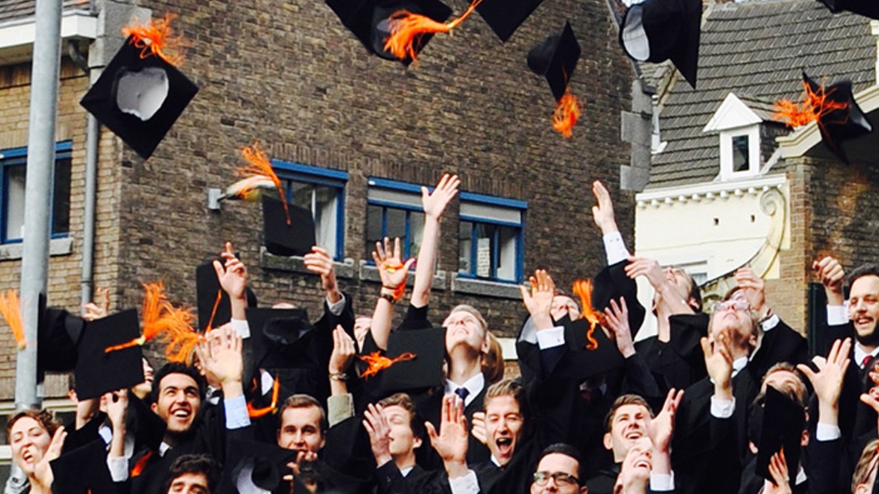 A group of graduates are throwing graduation cap as celebration; image used for HSBC international overseas education Landing Page