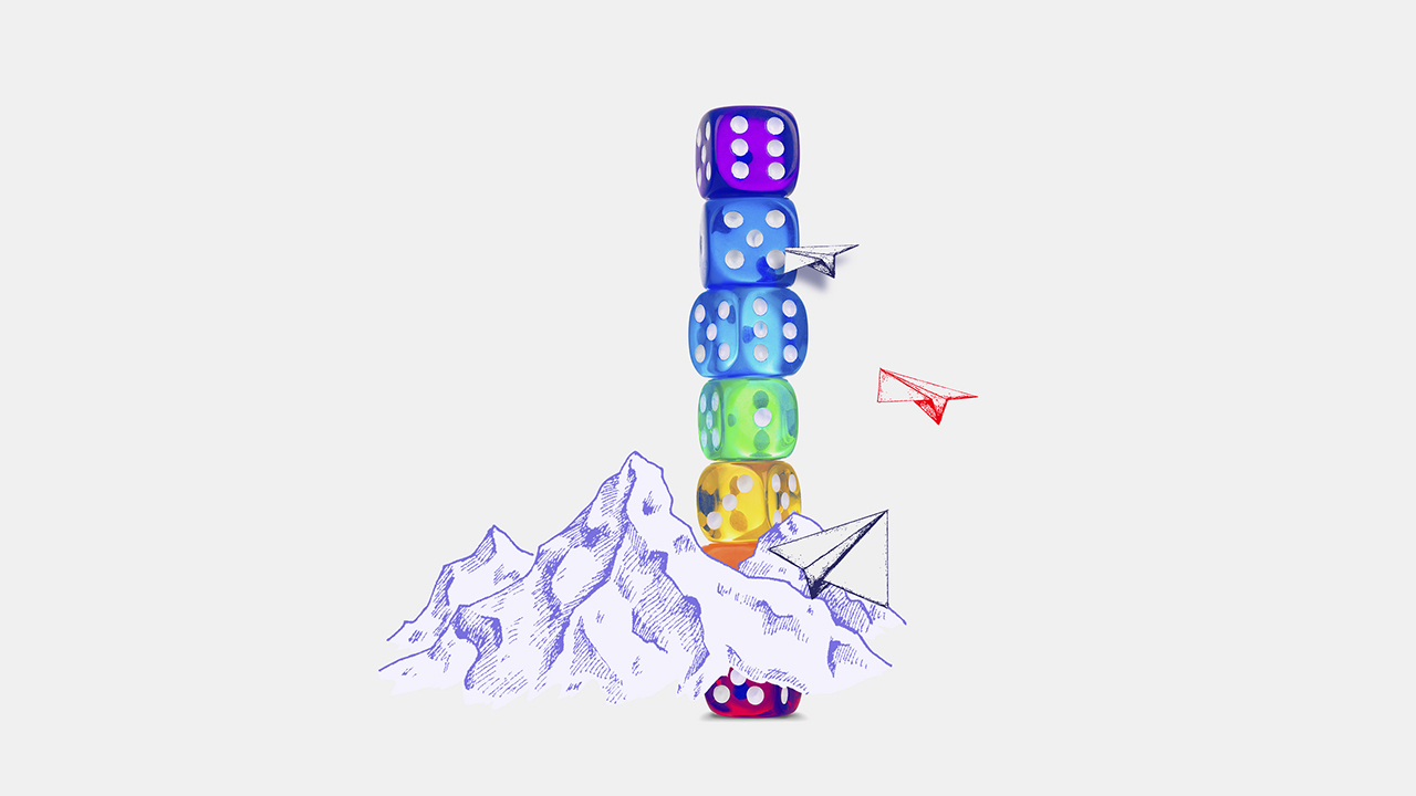 several dices stacked together behind a snow mountain