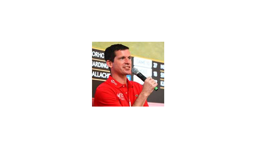 An athlete holding a microphone